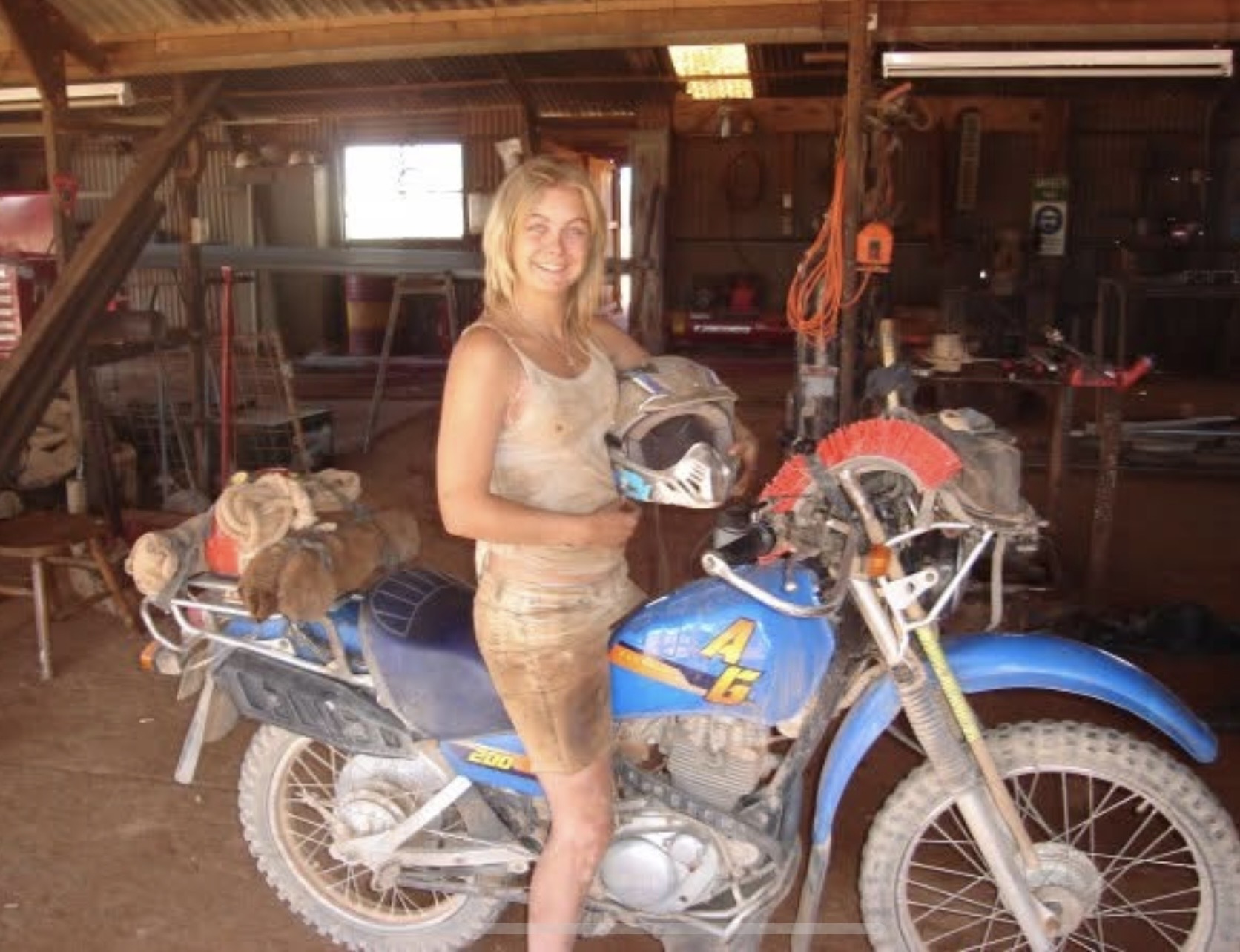 Jax during her early farm life beside a dirt bike